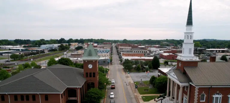 A brick building with a clock tower located in the Upstate of South Carolina.